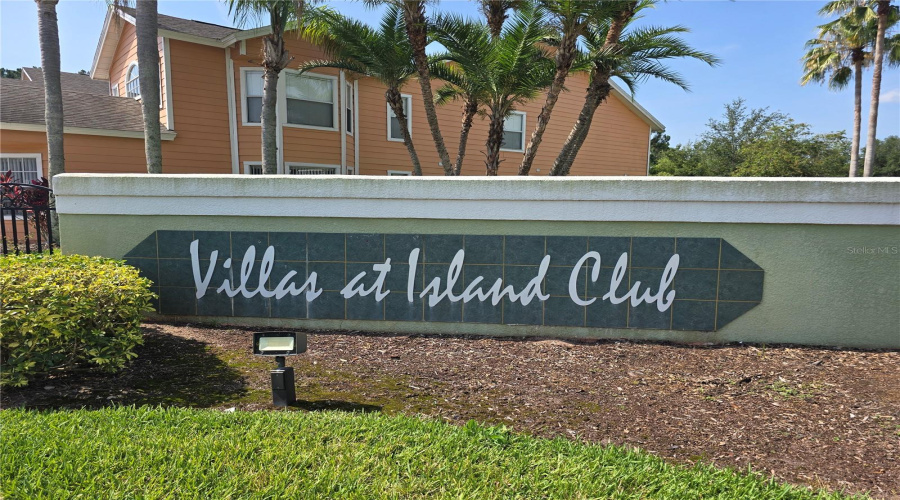 Entrance to gated community of Villas at Island Club. Prime location - Short and Long-term rental possibilities.