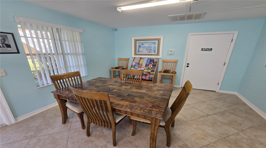 Clubhouse #1: interior seating, tables & area brochures.