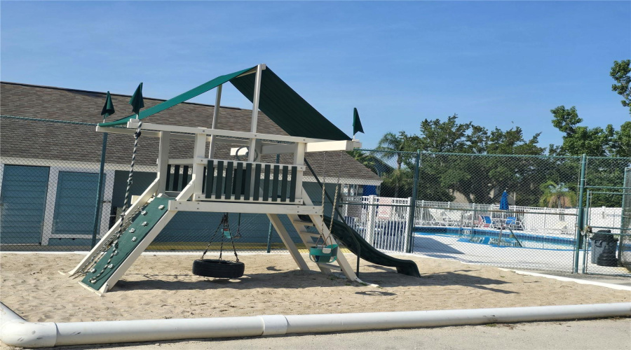 Playground next to clubhouse #2, tennis court and BBQ picnic area.