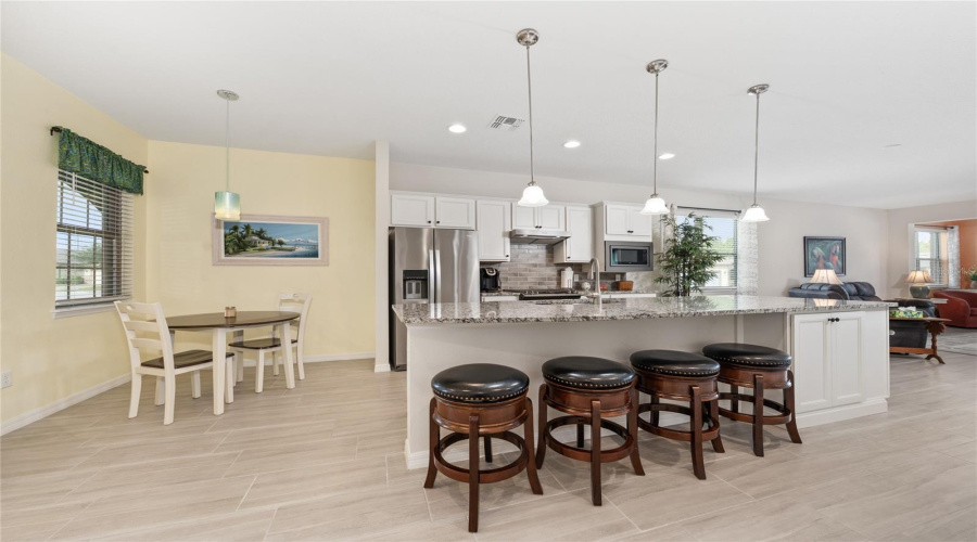 Morning Room Left Of Kitchen. Large Island With Seating And Cabinet Storage.