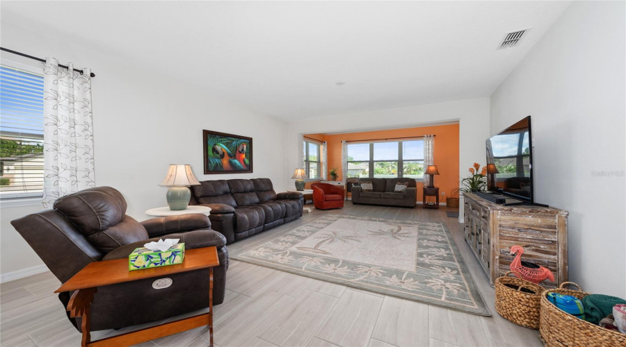 Open Combo Dining, Living, And Florida Room. {Dining Area Used For Extended Living Room.}