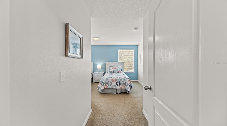 Twin Bedroom Sits Alongside Share Bathroom