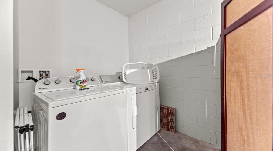 Laundry Facilities Located At The Rear Of The Garage