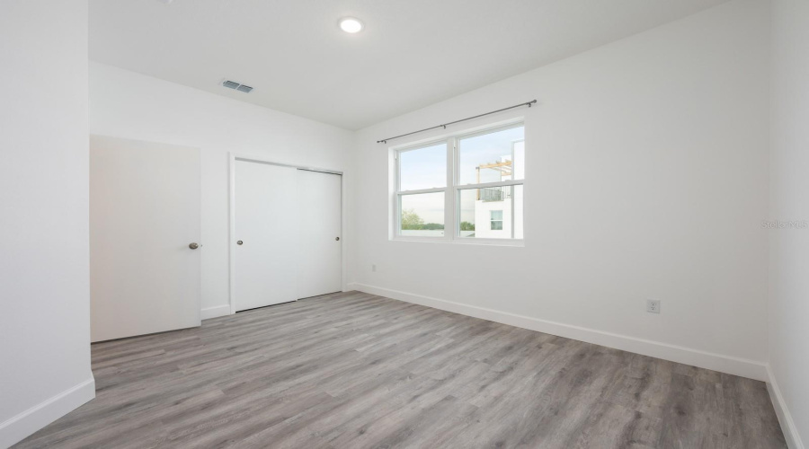 Perfectly sized, Bedroom 5 can easily serve as a guest bedroom or be transformed into an office or creative retreat.
