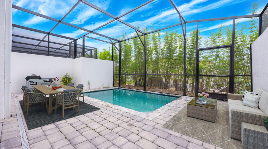 Enjoy your own PRIVATE SCREENED LANAI with a SPARKLING POOL, perfect for relaxing or entertaining in the Florida sunshine. Virtually staged.