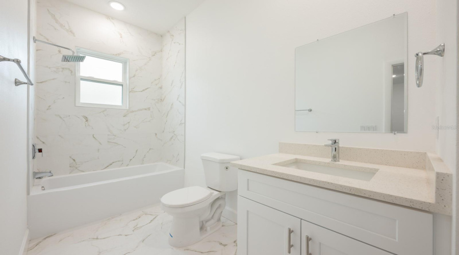 One of four bathrooms in the home, a 1st floor full Bathroom is easily accessible from the main living areas.