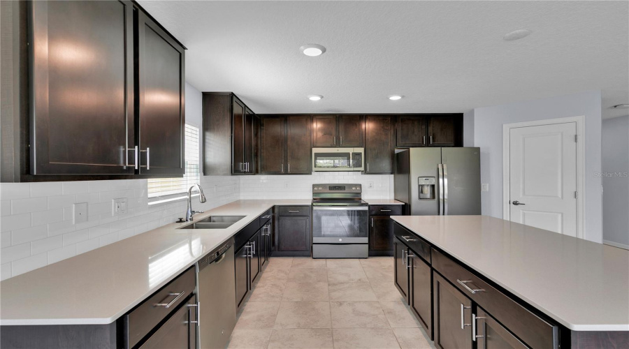 Kitchen with quartz countertops.