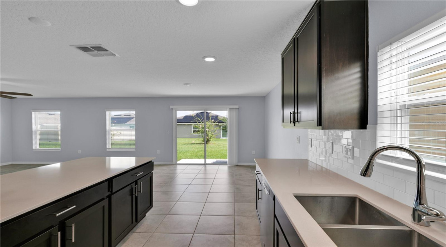 Kitchen with quartz countertops.