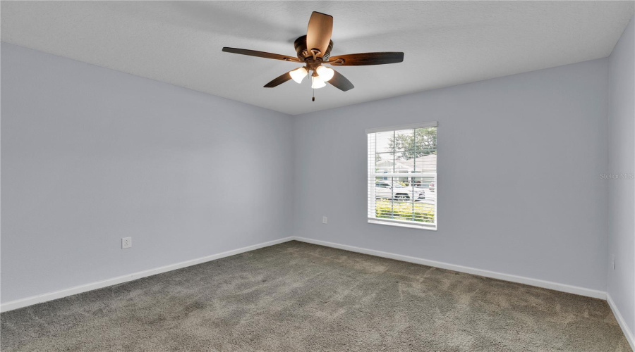 Comfortable second bedroom located at the front of the home