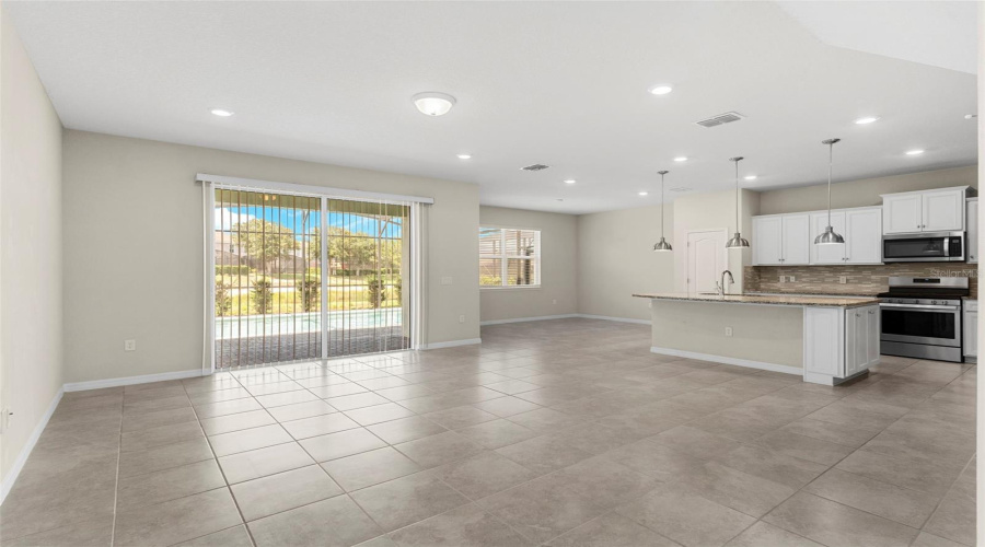 Spacious Living Room w/ Open Concept Kitchen & Dining Room behind