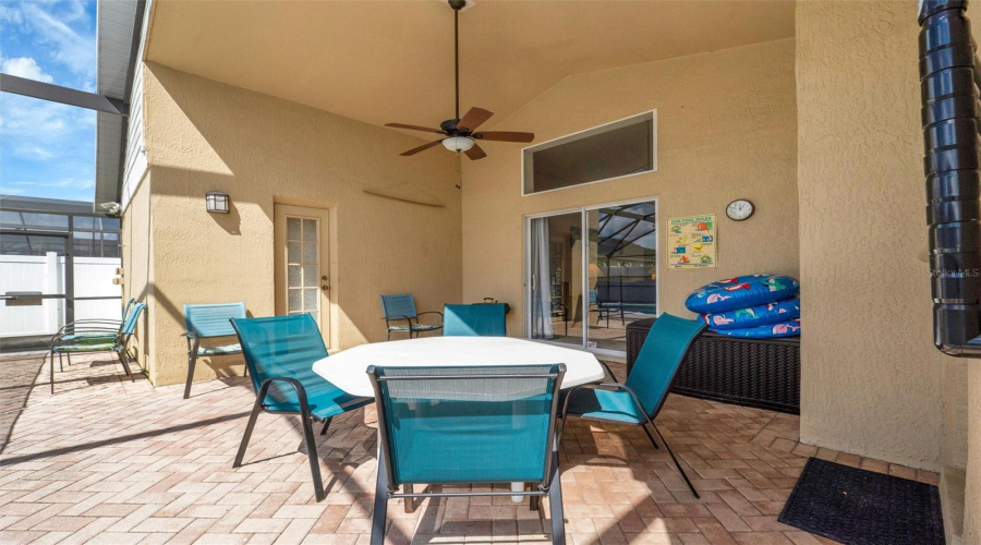 Brick pavers cover the pool deck