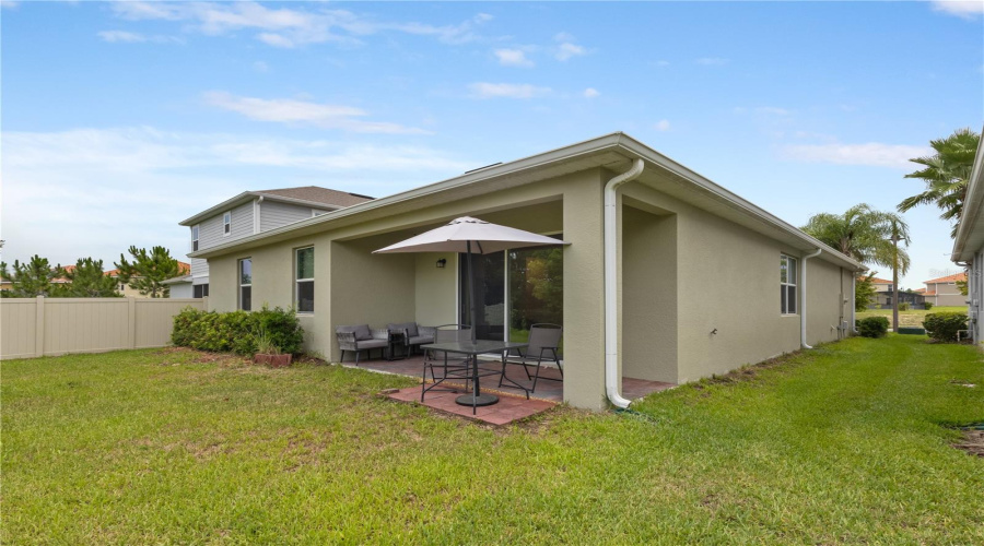 Backyard with Lake Views and Covered Lanai