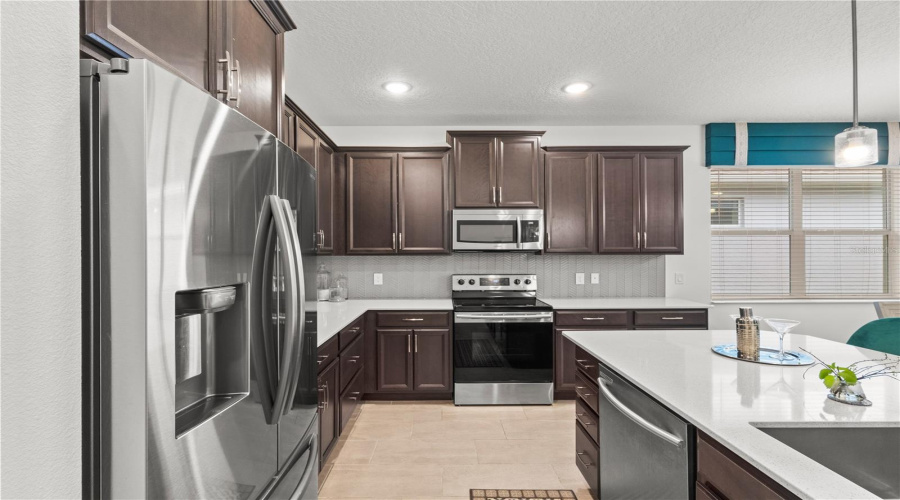 Upgraded Builders Model Kitchen with Quartz Countertops