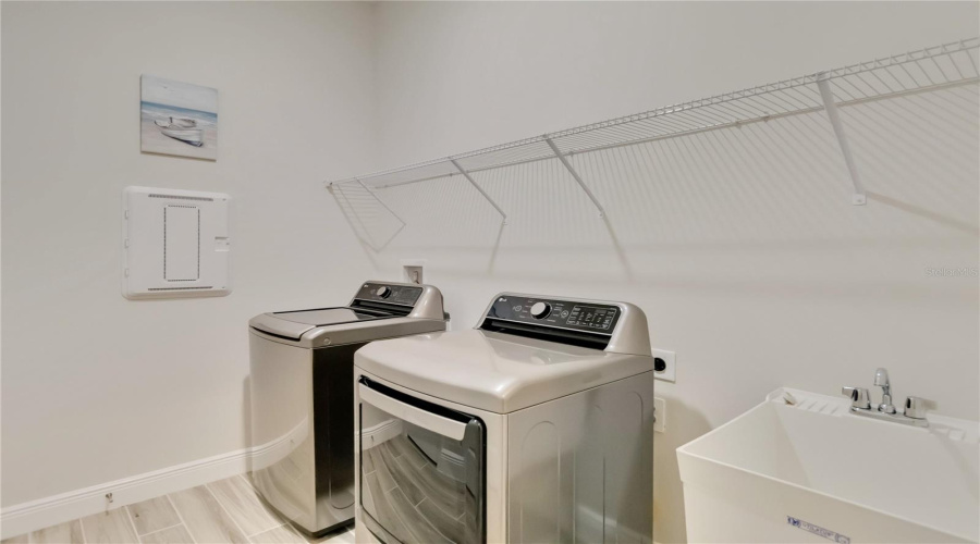 Large laundry room with like new washer and dryer