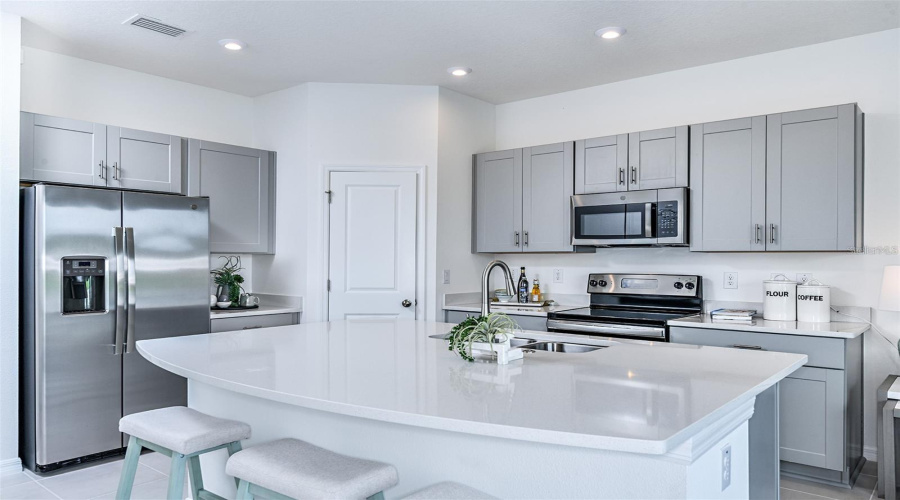White cabinets are what is in the home.