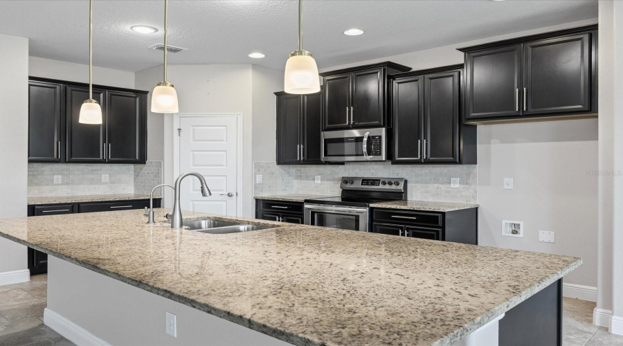 Kitchen has 42" cabinets with crown molding