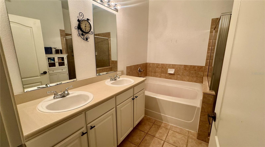 All bathroom cabinets have been resurfaced to white with new hardware as pictured