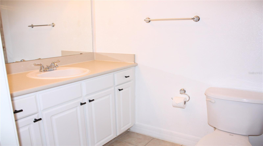 Guest bathroom with resurfaced cabinets