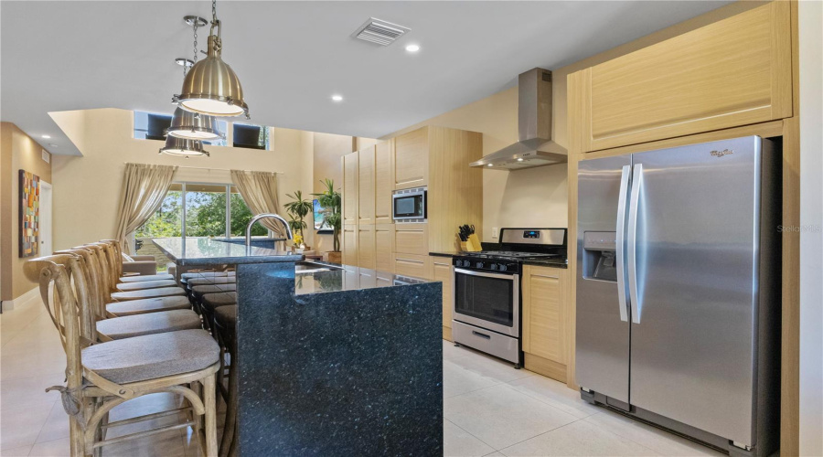 Spacious kitchen island and Double door refrigerator.