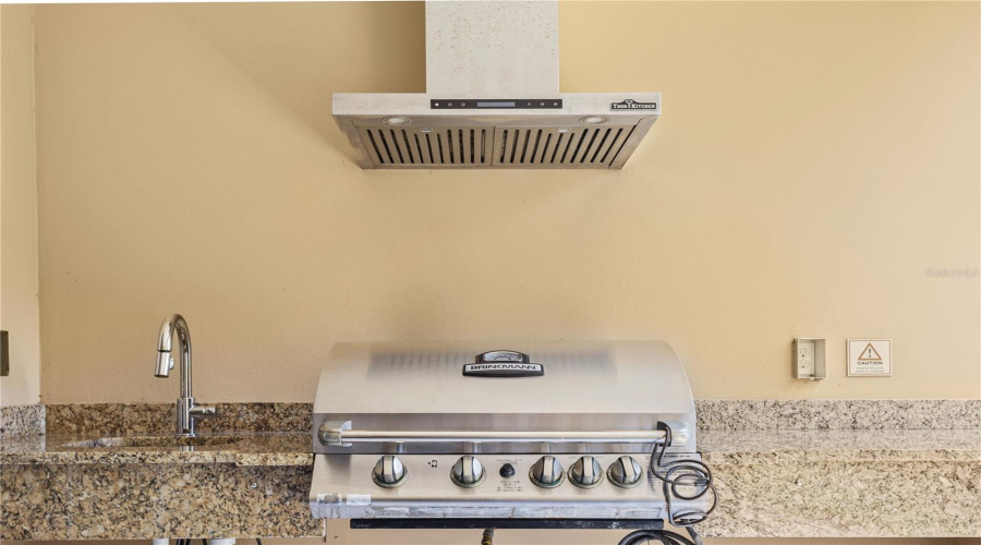 Granite, sink and Grill.