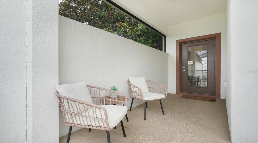 screen enclosed Lanai with seating
