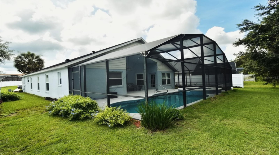Backyard view of Screened Pool & Lanai