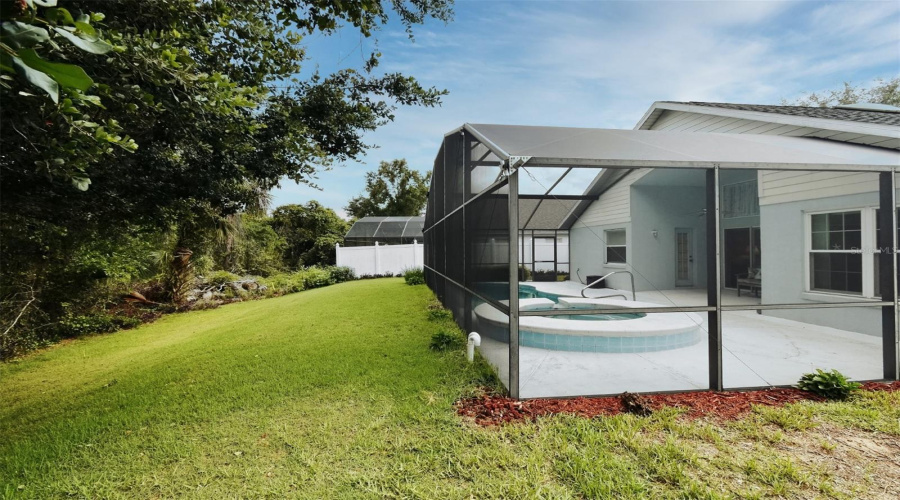Backyard view of Screened Pool & Lanai