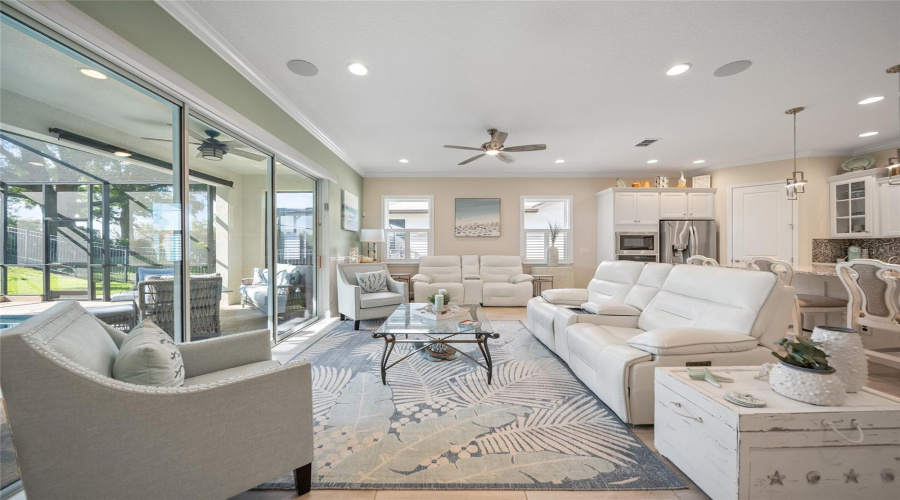 Bright, open living space with seamless flow to the lanai and private pool views.