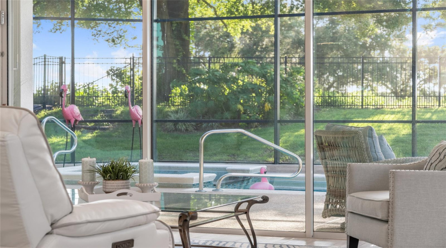 Relax with poolside views and morning sun right from your cozy indoor seating area.