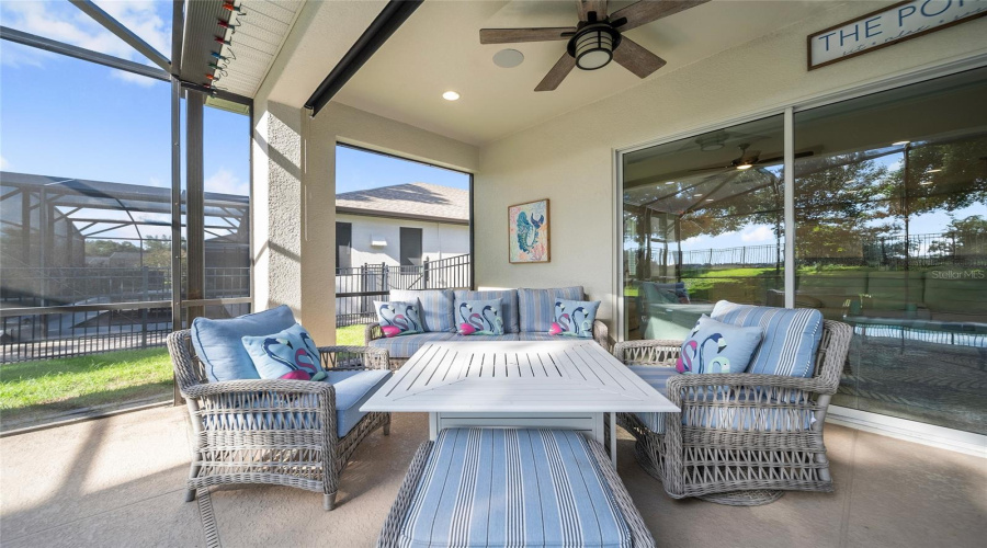 Relax in your screened-in lanai with comfy seating and peaceful views of the golf course.