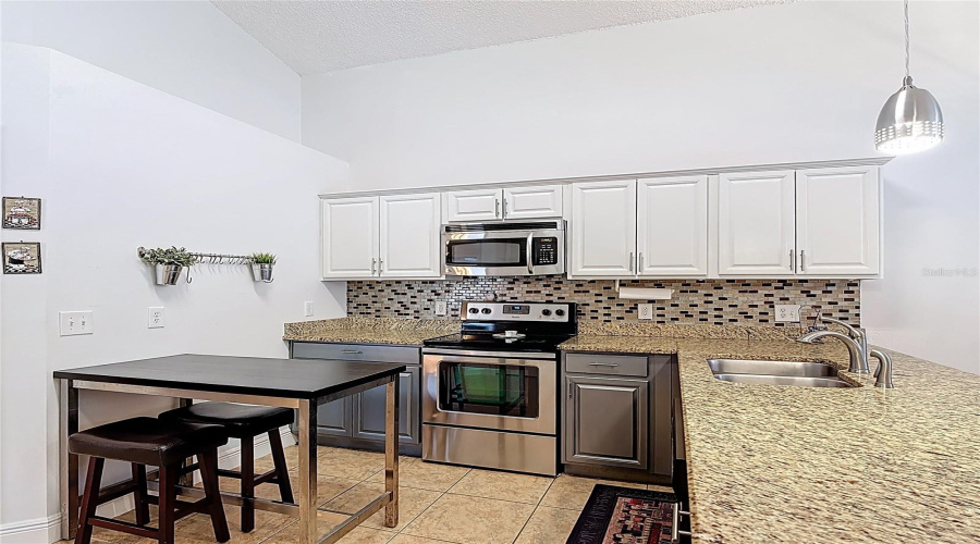Kitchen with stainless steel appliances and granite countertops
