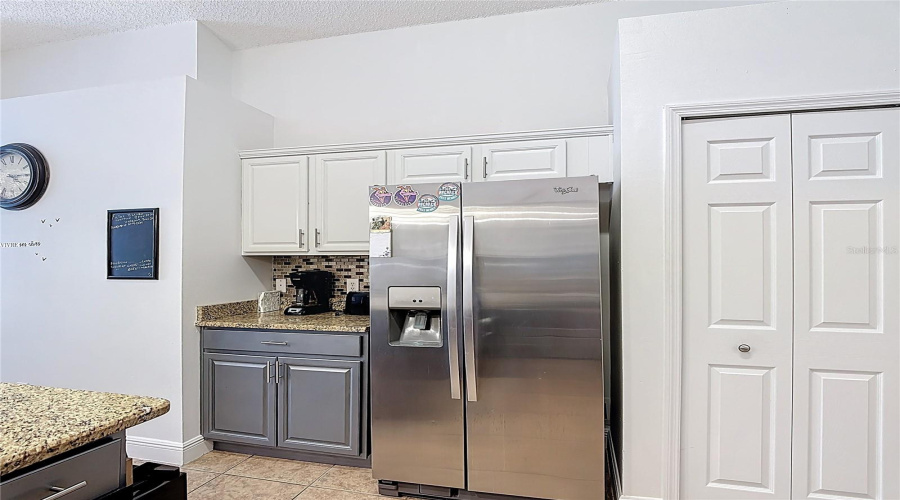 coffee bar, refrigerator and pantry