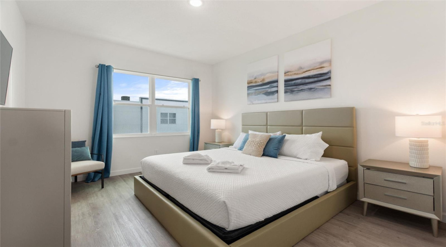 Master bedroom with King Sized bed and flat screen TV.