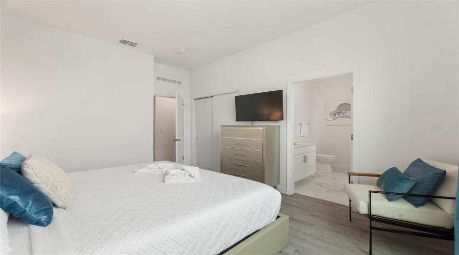 Master bedroom with King Sized bed and flat screen TV.