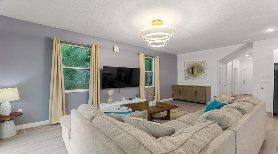 Beautifully furnished living room with plenty of seating!!