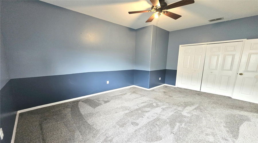 Bedroom 2 with Custom Built-ins in Closet