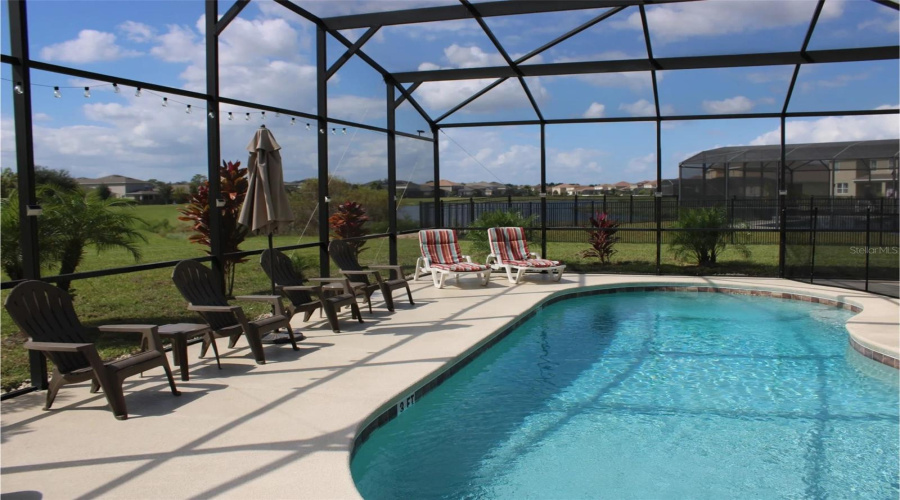 Sparkling blue private pool with extended deck for added space