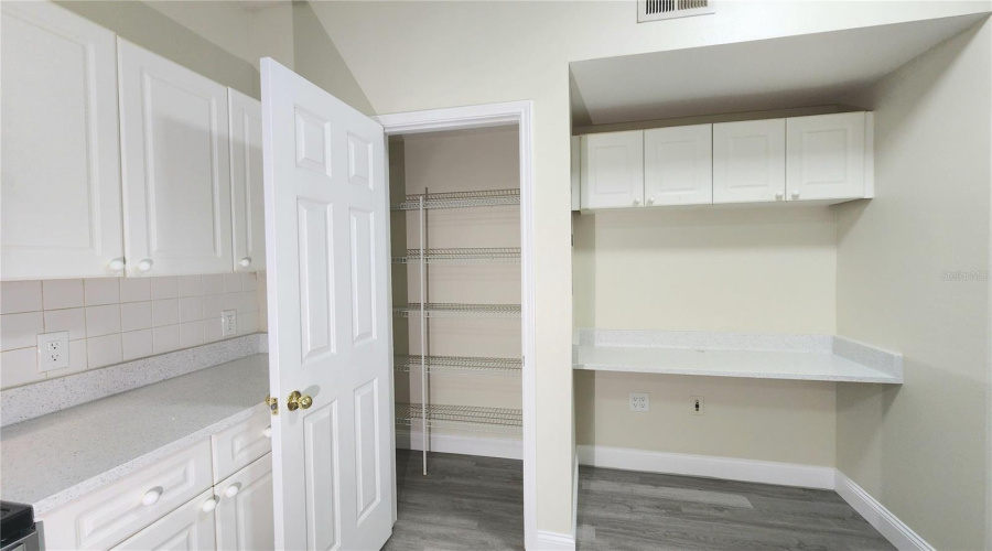 LARGE WALK-IN PANTRY & STONE TOP DESK AREA W/ UPPER CABINETS!
