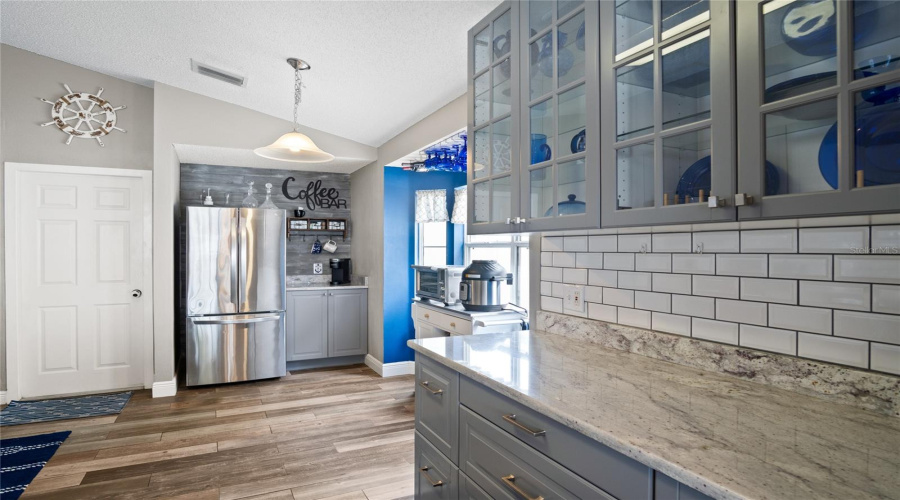 A classy look with a place to display your favorite pieces, and a Coffee Bar for the diehard Coffee Lovers.