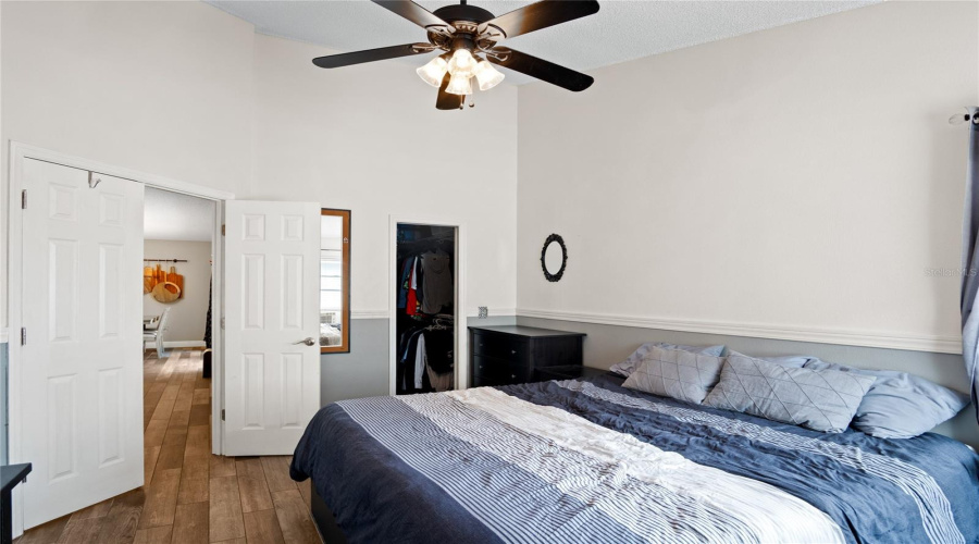 A view looking toward the living room and the walk-in closet.