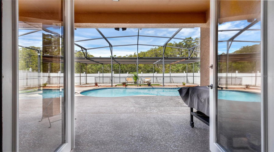 French Doors Open to Screened In Pool