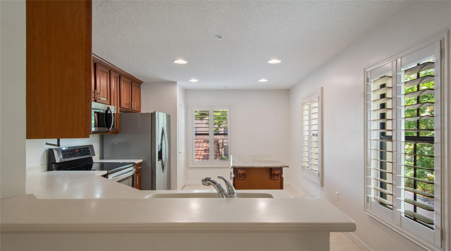 The kitchen has three windows making this space very bright and inviting
