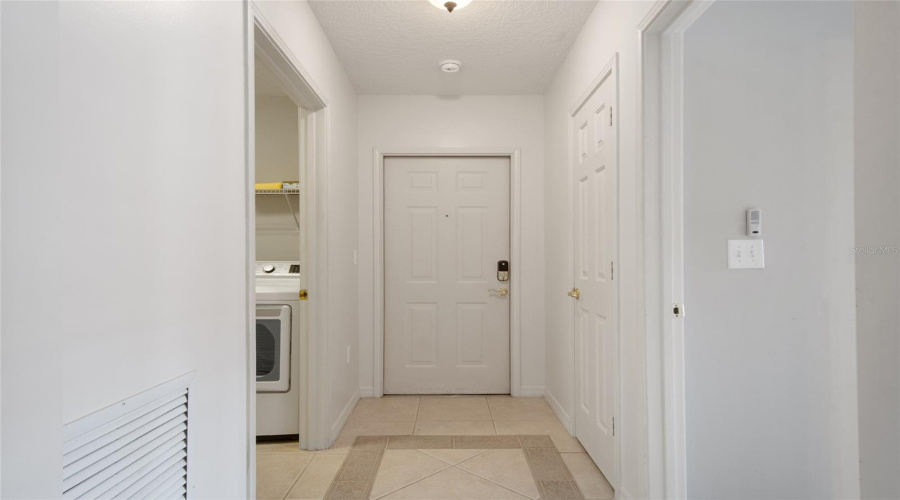 Upon entering there is a coat closet on the left and the laundry room is on the right.
