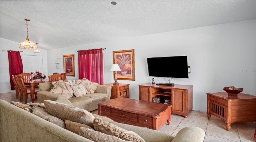 The open family and dining room area has vaulted ceilings.