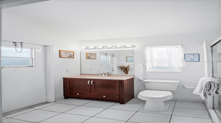 The primary bathroom leading out to the pool.