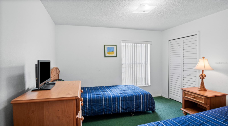 Walk down the hallway to the second guest bedroom.