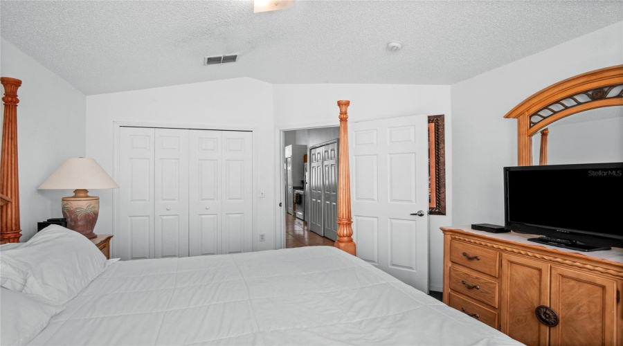 The guest bedroom taking you out to the kitchen.