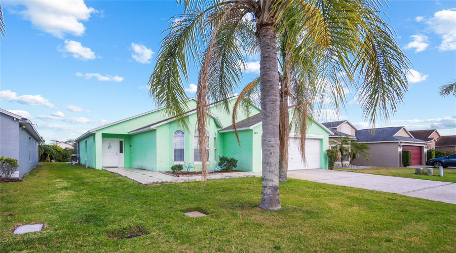 The soft hue evokes a breezy, tropical feel, offering instant curb appeal and a sense of calm and relaxation.