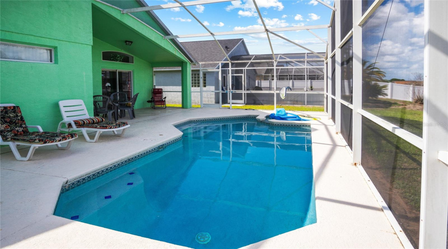Looking to the north from the end of the pool showing a shelf that will allow you to shill out at the deep end.