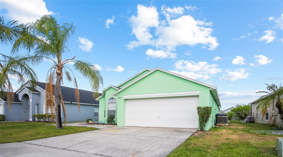 Palm trees out front add to a tropical Florida feel.